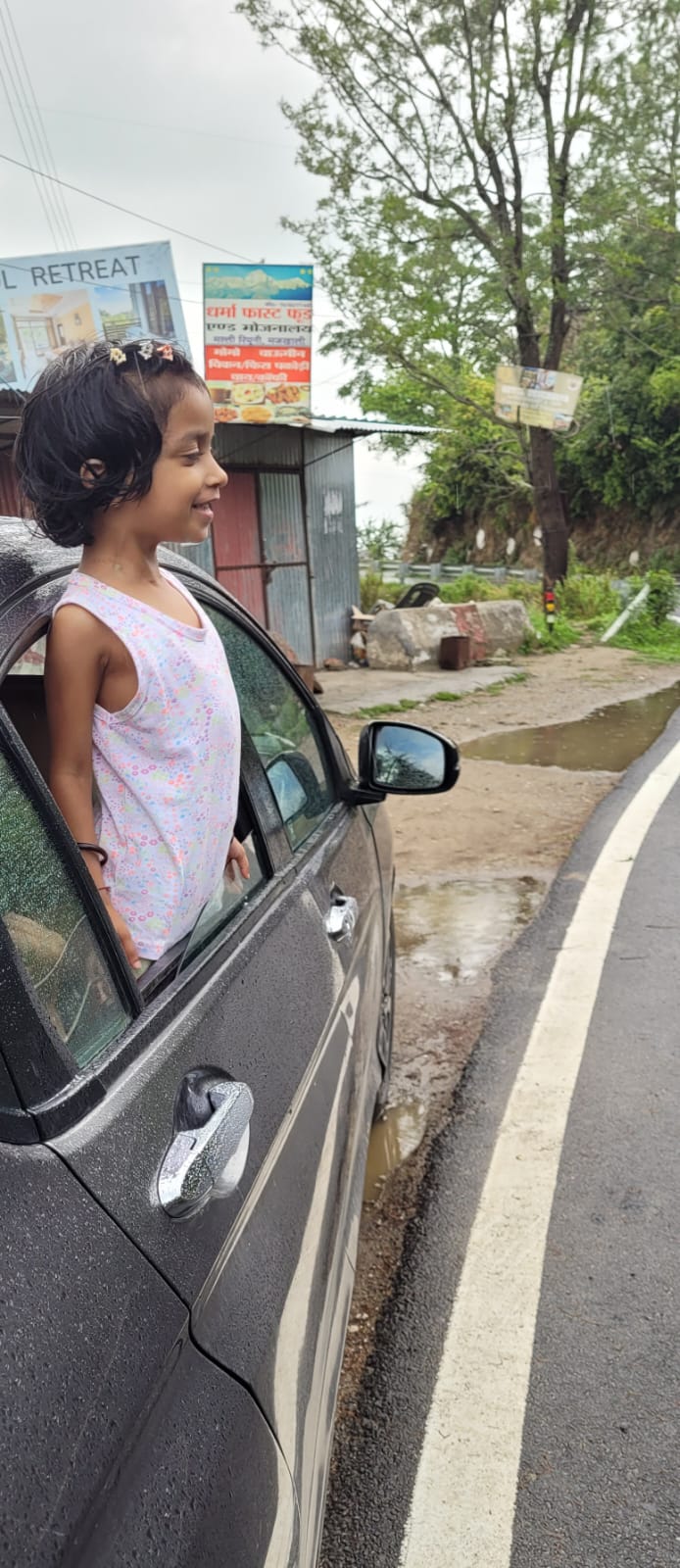 Anaya by the car window